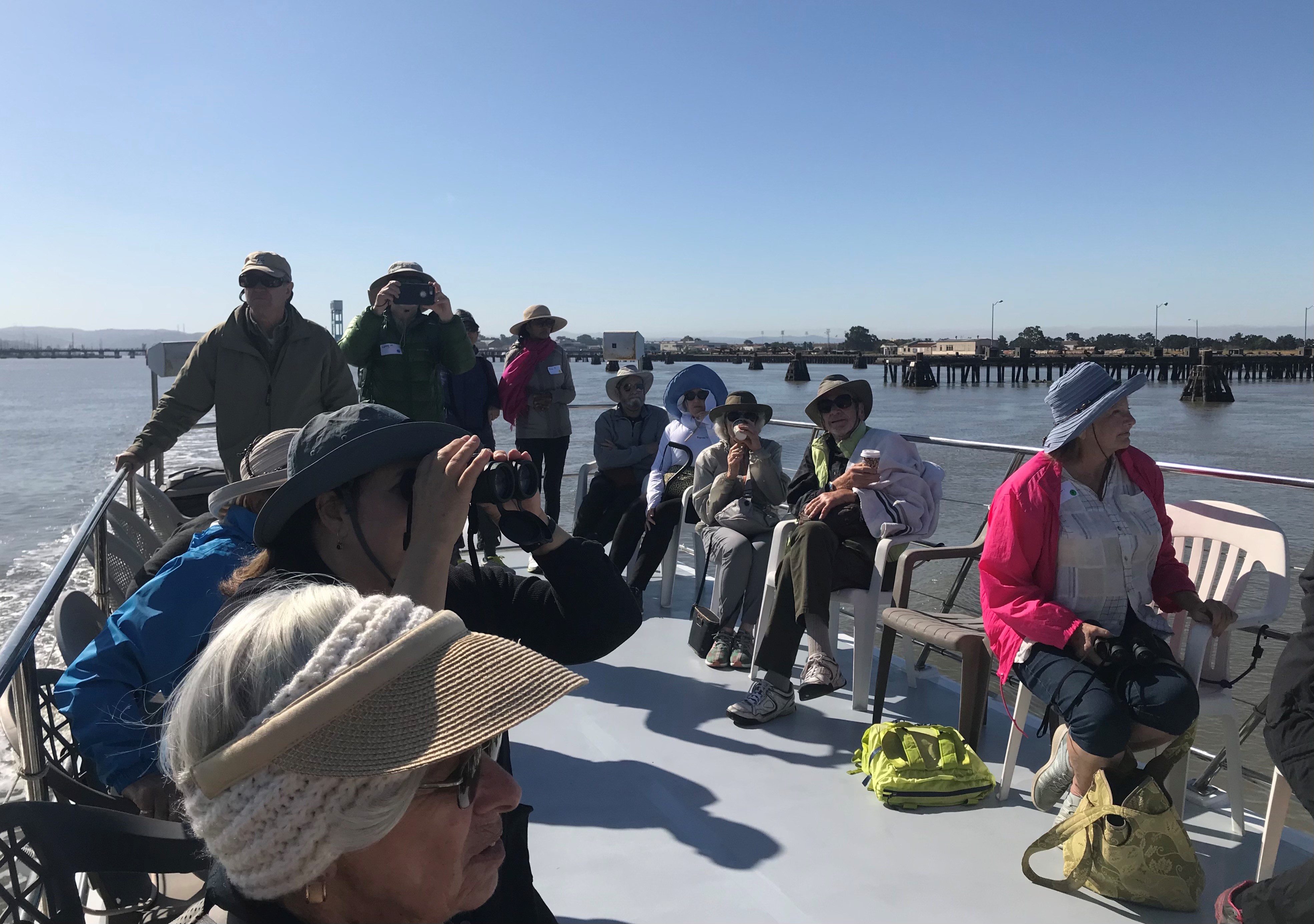 OLLI members seated on the upper deck enjoying amazing 360-degree views of the river, surrounding wetlands and the Mayacamas Mountain Range in the distance.