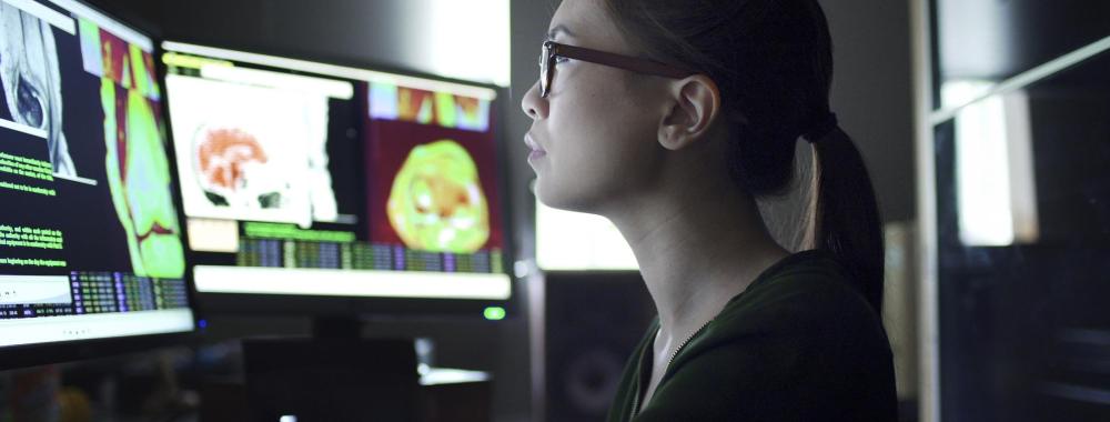 woman at computer looking at health data