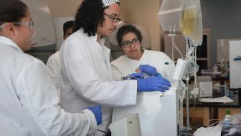 Cell and Gene therapy students working in lab
