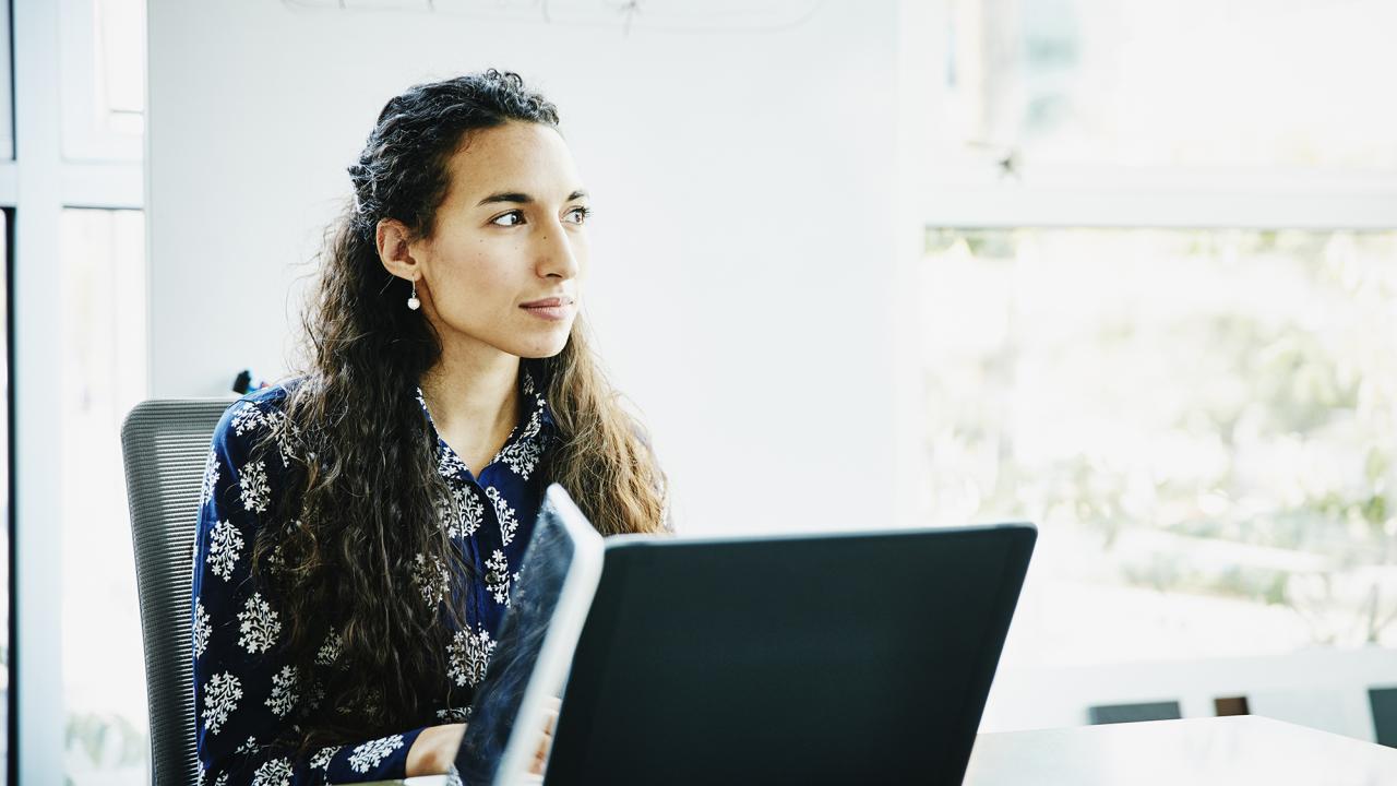 female professional sitting at computer