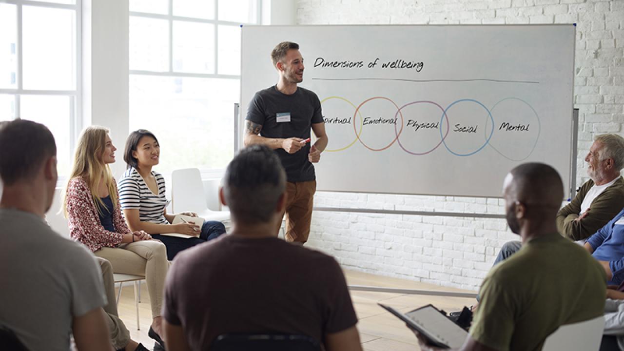 Group of individuals learning about wellness