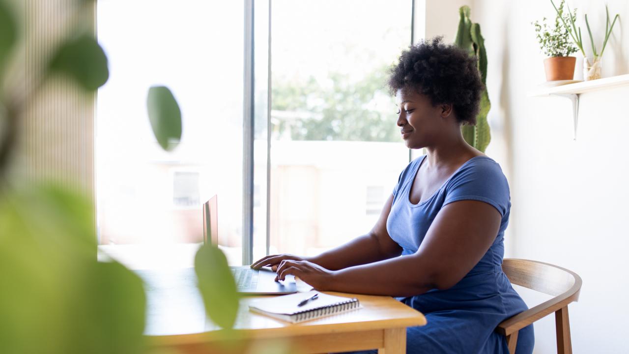young woman on laptop at home