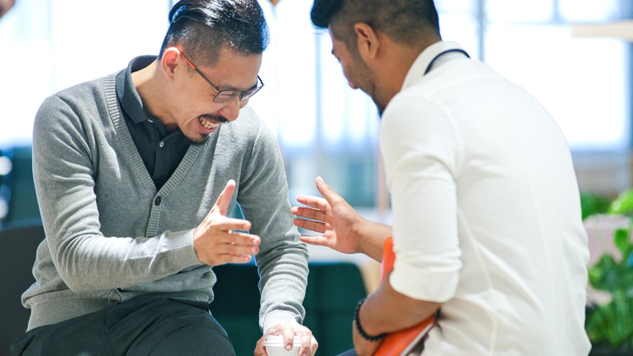 Human Resource Manager having casual discussion with new staff