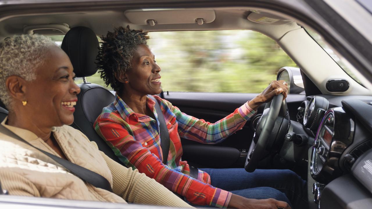 Two women driving car