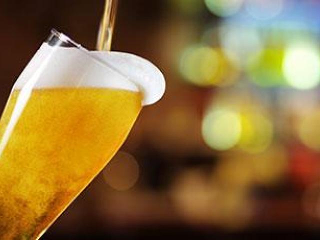 pouring beer into glass
