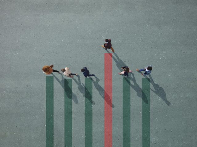 Abstract image shot from above. Business people walk along bar graph