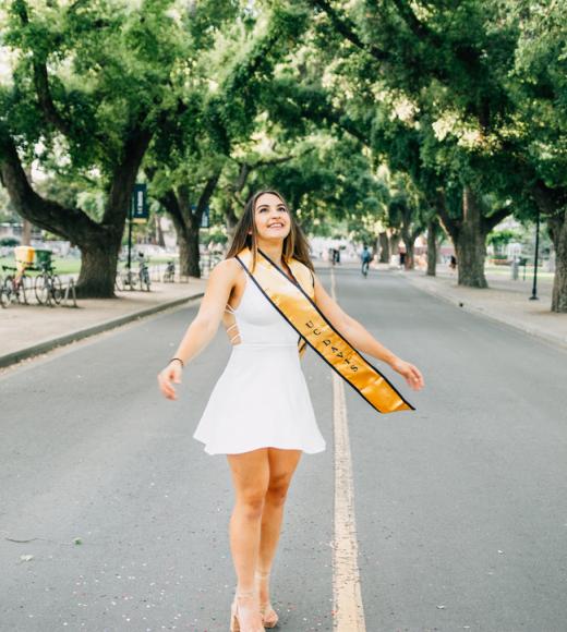 UC Davis post-bac student Gabby Rich poses at the Quad on UC Davis campus for graduation photos