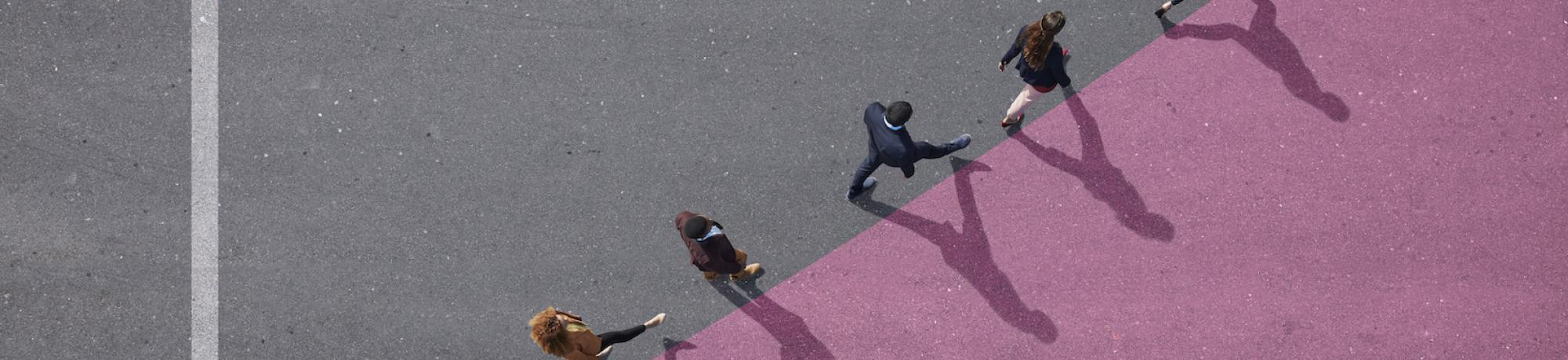 Abstract image shot from above. Business people walk along a graph line that's going up, indicating growth