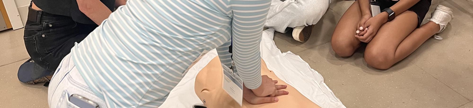 Students practice CPR after learning the basics during the UC Davis Pre-College Program